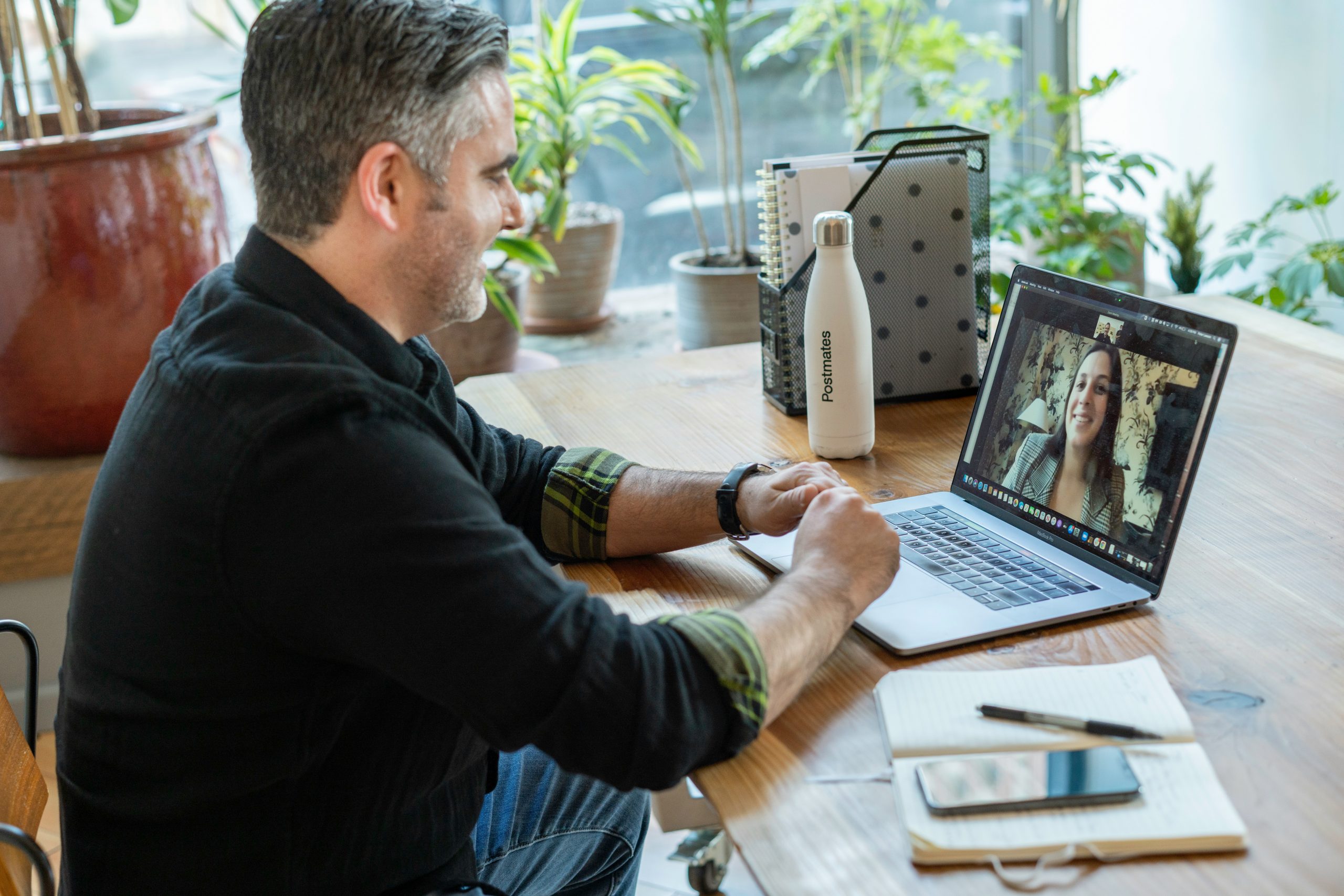 Person using their laptop for a team meeting