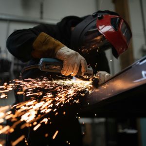 Person working in a factory, welding