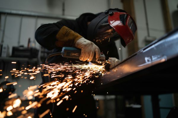 Person working in a factory, welding