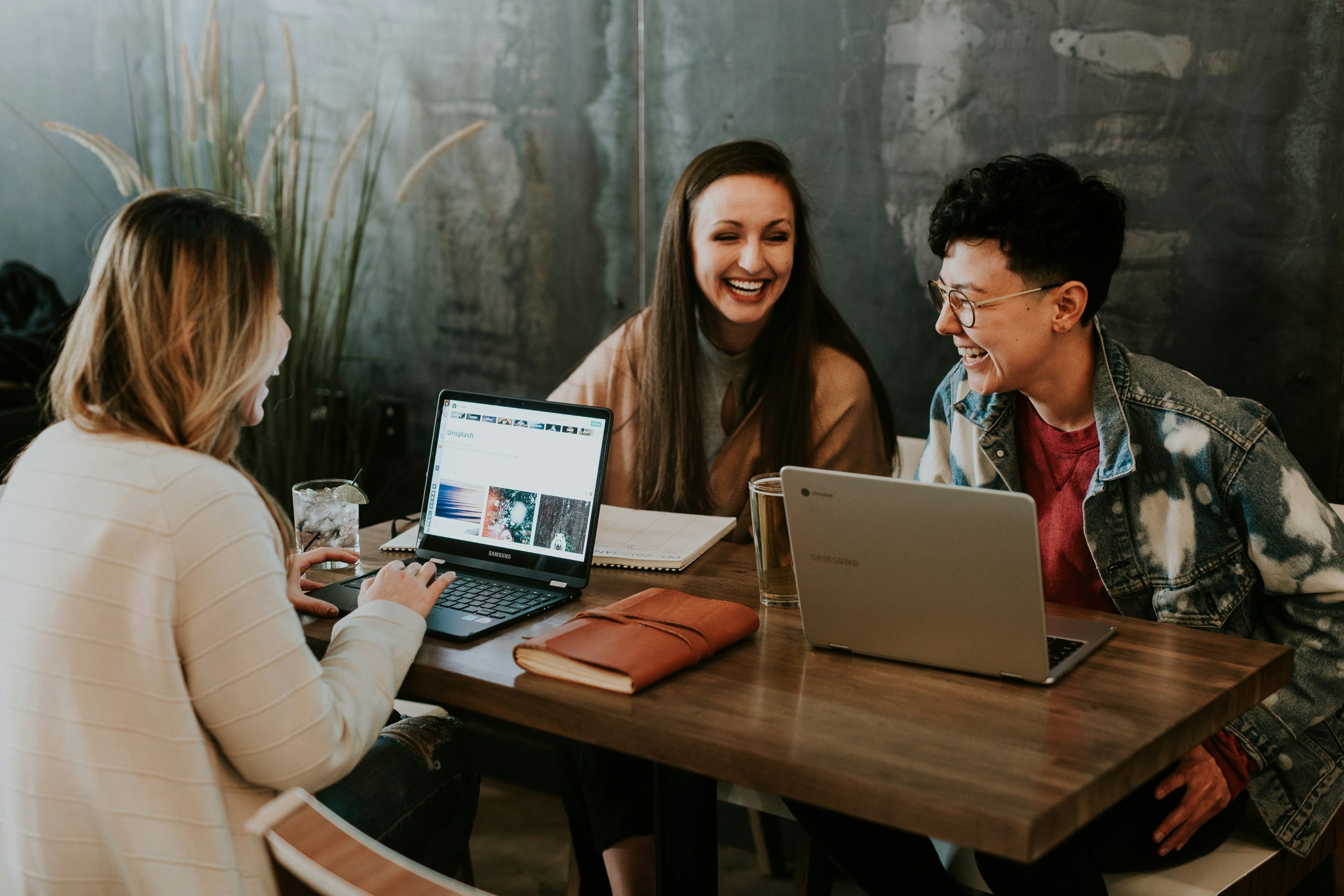 3 people in a small meeting room