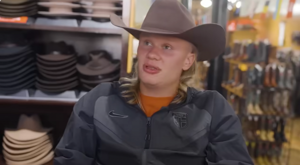 Erling Haaland pictured in a cowboy hat in his Norway training gear